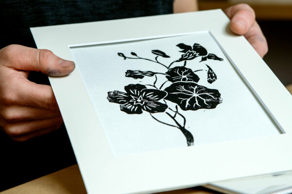 Oprawiona praca zrobiona na warsztatach linorytu